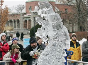CTY frozen17p    01/16/2010       The Blade/Lori King  Ice Creations carver Gary Christinson chisels a dragon head during Frozentoesen activities at the Toledo Zoo.
