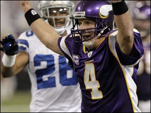 Minnesota's Brett Favre celebrates after throwing his fourth touchdown pass of the game.