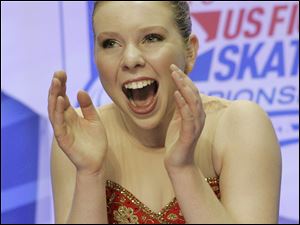 Rachael Flatt reacts with joy after seeing her score of 200.11 to win Saturday.