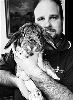 Brian Thompson and Max, one of his pet rabbits.