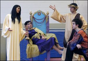 Rehearsing for St. Ursula Academy's upcoming production of ‘Jesus Christ Superstar' are, from left, Emely Ortiz as Jesus, Tyler Simms as Herod, Sean Burns as Pilate, and Mark Beyer as Judas.