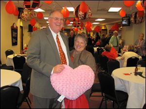 MALCOLM and PEGGY RICHARDS hold
a giant pink heart that they bought in the silent auction.
<BR>
<img src=http://www.toledoblade.com/graphics/icons/photo.gif> <font color=red><b>VIEW</font color=red></b>: <a href=