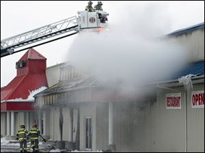 Firefighters battles a blaze at Stony Ridge Inn in Millbury.