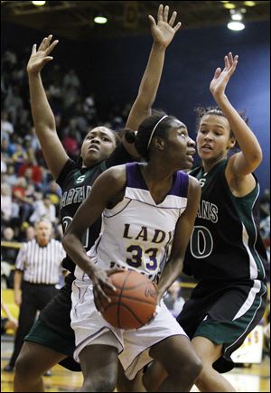Waite's Natasha Howard, who had 16 points and nine rebounds, looks to shoot against Start's Tiffani Blackman, left, and Azia Bishop. The Indians improved to 18-2. The Spartans fell to 16-4. 