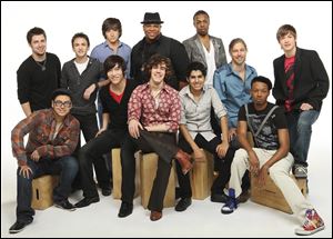 In this publicity image released by Fox, the 12 male finalists for the ninth season of the reality singing competetion, 