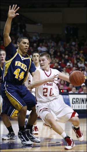 Central Catholic's Drew Lehman drives around Whitmer's Chris Wormley.
<br>
<img src=http://www.toledoblade.com/graphics/icons/photo.gif> <font color=red><b>PHOTO GALLERY</b></font>: <a href=