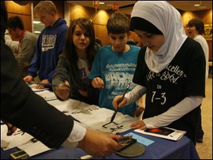 Springfield Middle School students, from right, Zainab Hussein, Andrew Jacobs, Tiffany Osborn, and Ben Baumgartner practice Chinese calligraphy at the Chinese Lantern Festival Carnival at the University of Toledo. Yesterday's event on Chinese culture was sponsored by the Confucius Institute at UT.
<br>
<img src=http://www.toledoblade.com/graphics/icons/photo.gif> <font color=red><b>PHOTO GALLERY</b></font>: <a href=" /apps/pbcs.dll/gallery?Avis=TO&Dato=20100226&Kategori=NEWS04&Lopenr=226009998&Ref=PH"_blank"> <b> Celebrating Chinese culture: </b></a> Feb. 27, 2010