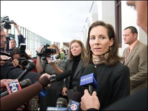 Jenny Sanford leaves court after a hearing for her divorce from South Carolina Gov. Mark Sanford, who admitted an affair with a woman from Argentina.