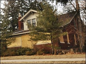 The Arts-and-Crafts-style house with four bedrooms and two bathrooms is on land that Taylor, Mich., wants for a park.