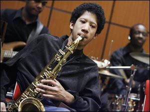 Libbey High School sophomore Nate Bruce plays tenor saxophone in his school's jazz ensemble at the Toledo-Lucas County Public Library program Expression of Culture through the Performing Arts. Yesterday afternoon's free program, part of the library's Black History Month celebration, was at the main library downtown.