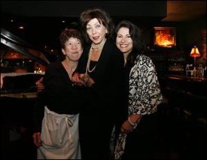 Kelley Berry, left, Fifi Berry, center, and Sena Mourad enjoy the Valentine's luncheon and fashion show at Fifi's.
<br>
<img src=http://www.toledoblade.com/graphics/icons/photo.gif> <font color=red><b>PHOTO GALLERY</b></font>: <a href=