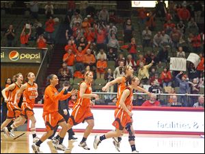 Bowling Green players rush the court after securing a sixth consecutive regular-season crown.