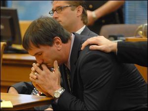 Scott Speer, front, and his attorney J. Anthony Rich react to the jury's decision in his murder trial Oct. 24, 2007, in Port Clinton.