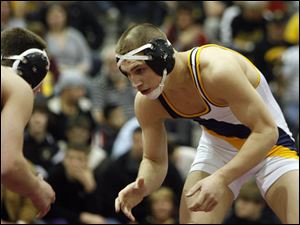 Jordan Cowell of Archbold, right, battles Payton Oney of South Central in the 135-pound division in Division III district finals.
