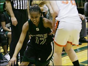 Start's Maleeka Kynard, No. 12, drives past Southview's Tiffany Scott in the semifinal game. Kynard racked up 25 points in Start's win over the Cougars.
<BR>
<img src=http://www.toledoblade.com/graphics/icons/photo.gif> <font color=red><b>PHOTO GALLERY</b></font>: <a href="/apps/pbcs.dll/gallery?Avis=TO&Dato=20100305&Kategori=SPORTS12&Lopenr=305009997&Ref=PH"_blank"> <b> Southview - Start - Division I district girls basketball semifinals</b></a> 