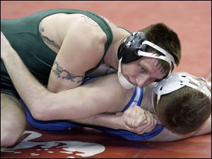 Clay's Mark Orth puts Shawn Fayette of Miamisburg, defending state champion, on his back in the 135-pound Division I preliminaries at Ohio State University's Schottenstein Center. 
<br>
<img src=http://www.toledoblade.com/graphics/icons/photo.gif> <font color=red><b>PHOTO GALLERY</b></font>: <a href="/apps/pbcs.dll/gallery?Avis=TO&Dato=20100304&Kategori=SPORTS12&Lopenr=305009999&Ref=PH"_blank"> <b> Division I state wrestling tournament</b></a>