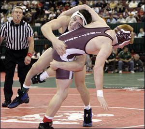 Oak Harbor's Ian Miller takes down Canal Winchester's Conrad Rosch in the 145-pound state semifinals at the Schottenstein Center.
<BR>
<img src=http://www.toledoblade.com/graphics/icons/photo.gif> <font color=red><b>PHOTO GALLERY</b></font>: <a href=