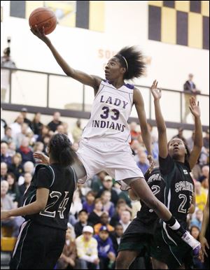 Waite's Natasha Howard goes to the basket against Start's Charon Sweeney (24) in a Division I girls district basketball final at Perrysburg. Waite (21-2) plays Tuesday against Lorain Southview.
<br>
<img src=http://www.toledoblade.com/graphics/icons/photo.gif> <font color=red><b>PHOTO GALLERY</b></font>: <a href=