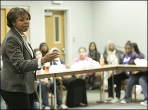 Crystal Harris of the YMCA's Youth Opportunities program speaks on ways to be engaged in education. Yesterday's ‘Momentum 2010' drew more than 170 girls from all over northwest Ohio.