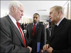 Michael Cicak of Perrysburg's Willard & Kelsey, left, who met with state Treasurer KevinBoyce, center, and Gov. Ted Strickland last month, says his firm will expand in July.