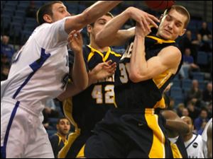 Buffalo's Max Boudreau, left, battles UT's Jordan Dressler, center, and Jake Barnett for a rebound.