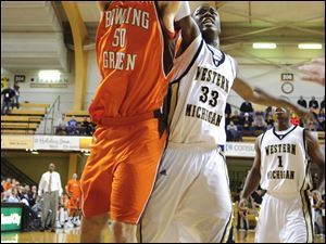 Bowling Green's Marc Larson grabs a rebound away from Western's Flenard Whitfield.