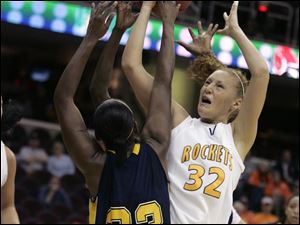  Kent's Yoshica Spears and UT's Melissa Goodall reach for a rebound during First Energy MAC Women's Basketball semi-final at Quicken Loans Arena in  Cleveland, OH.