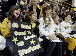 Courtney Cross, left, Payton Carter, Kelsi Omey, Lauren Elliott, and Morgan Korn cheer the Northview hockey team during a pep rally at the Sylvania school a day before today's semifinals in Columbus.