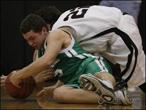 Ottawa Hills J.J. Buckey, left, battles Norwalk St. Paul's Brian Griffin for a loose ball. Buckey led the Green Bears with 17 points.
<br>
<img src=http://www.toledoblade.com/graphics/icons/photo.gif> <font color=red><b>PHOTO GALLERY</b></font>: <a href="/apps/pbcs.dll/gallery?Avis=TO&Dato=20100313&Kategori=SPORTS12&Lopenr=313009999&Ref=PH"_blank"> <b>  Ottawa Hills - Norwalk St. Paul D-IV boys district final</b></a> 
