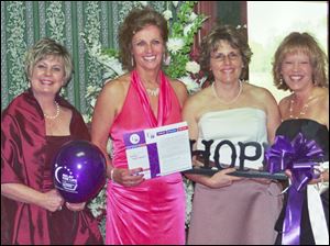 Anne Gregory, right, with friends LeaAnn Hayes, Cindy Brown, and Becky Holtsberry at Mrs. Gregory's Cinderella Ball, a fund-raiser for the American Cancer Society.