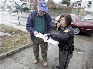 Marshall Isenberg and Deputy Barb Lau discuss a property for which they are determining a value.
Mr. Isenberg and other private appraisers are training Deputy Lau to do the job they are losing.