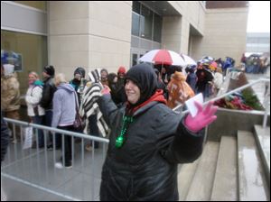 Mandy Flagg of Perrysburg Township nabs third-row seats for the April 25 concert. She had camped overnight at the arena.