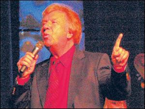 Bill Gaither in concert in Toledo in November, 2008.