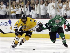 Northview's Nolan Culver gets to the puck before Evan Bowdy. Culver scored two goals in the Wildcats' semifinal victory.