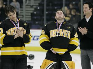 Northview High School hockey players Brent Easton, left, and Austin Gryca and coach Mike Jones can't conceal their disappointment after the Wildcats were defeated 4-1 by Cleveland St. Ignatius in the state boys' championship hockey game in Columbus Sunday.
<br>
<img src=http://www.toledoblade.com/graphics/icons/photo.gif> <font color=red><b>PHOTO GALLERY</b></font>: <a href="/apps/pbcs.dll/gallery?Avis=TO&Dato=20100315&Kategori=SPORTS12&Lopenr=315009999&Ref=PH"_blank"> <b> Northview - St. Ignatius state hockey finals</b></a> 
