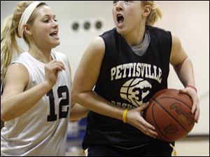 Pettisville's Rachel Beck, left, guards fellow Blackbird Erika King during a practice. King leads the team in scoring and is among the tops in rebounds and steals.