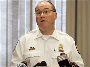 Chief Mike Navarre's plan includes closing a district station and transferring school officers, among others, to new duties.