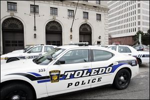 The number of sworn officers on the Toledo force would fall to about 460 after layoffs and would drop further with retirements.  