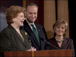 From left, Sens. Debbie Stabenow (D., Mich.), Charles Schumer (D., N.Y.), and Barbara Boxer (D., Calif.) speak at a news conference after the passing of the jobs bill.