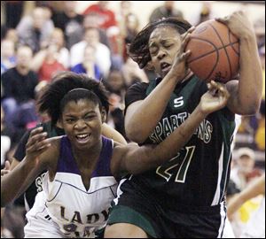 ShaniceMcNeal, a 6-foot-2 junior, battles Start's Tiffani Blackman for the ball in a Division I district final. McNeal averages 13.2 points and 9.1 rebounds for the Indians.