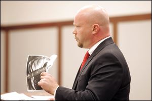 Robin Vess' attorney, Mark Davis, cross-examines Humane Society officer Nancy Silva. Mr. Davis said  more evidence would come out if the case goes to trial.
