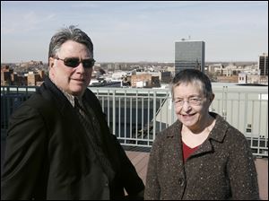 Developer Joseph Swolsky surveys the view from the building's roof with Karen Hakel, president of the Bartley Lofts homeowners association. The group will take over management of the project from Mr. Swolsky and his partner April 1. 