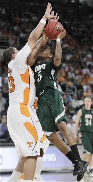 Ohio's D.J. Cooper can't get back Tennessee's Brian Williams during their second round NCAA tournament game.