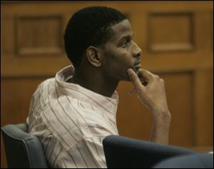 DeJuan Booker listens during his trial in Common Pleas Court. He is accused of killing Armond Parker on May 1.