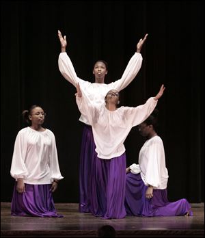 CTY notredame24p   03/23/2010       The Blade/Lori King  Notre Dame students from left: Tristan Burt, Chahdael Smith, back, Semone Wilbert and Israelle Nelson, performs a praise dance during the Notre Dame Academy multicultural assembly at the Toledo, OH school.