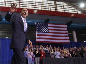 President Obama prepares to promote the health-care reform law during a stop in Iowa.