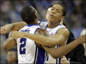 Duke's Andre Dawkins, right, and Nolan Smith bump chests during the Blue Devils' victory over Purdue in the NCAA tourney.