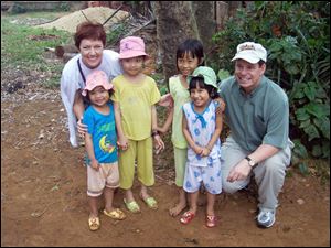 The fourth top Jefferson Award recipient, Fred Grimm, far right, is shown with his wife, Jill, and children of the Song Ve Valley.