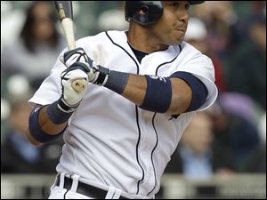 Detroit's Carlos Guillen hits a two-run double against Kansas City. The Tigers came back from a 5-0 deficit to beat the Royals.