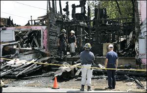 State fire investigators never determined what caused the apartment building fire that killed two men on July 13, 2008.